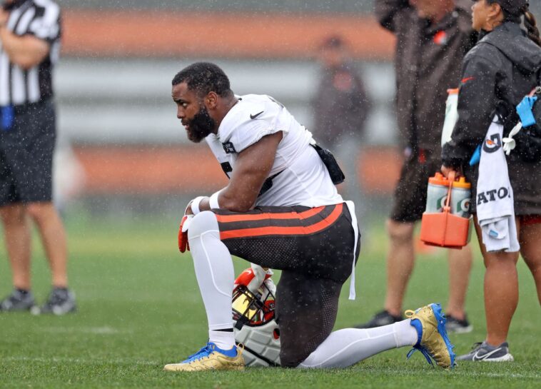 Cleveland Browns linebacker Anthony Walker Jr. watches play from the sidelines